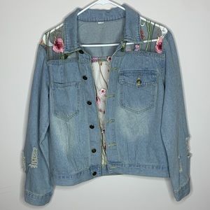 Hand crafted mesh embroidered jean jacket .